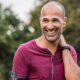 Man in Headphones in Purple Shirt