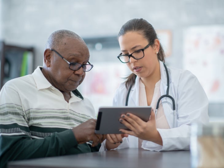 Doctor reviewing RPM readings with patient